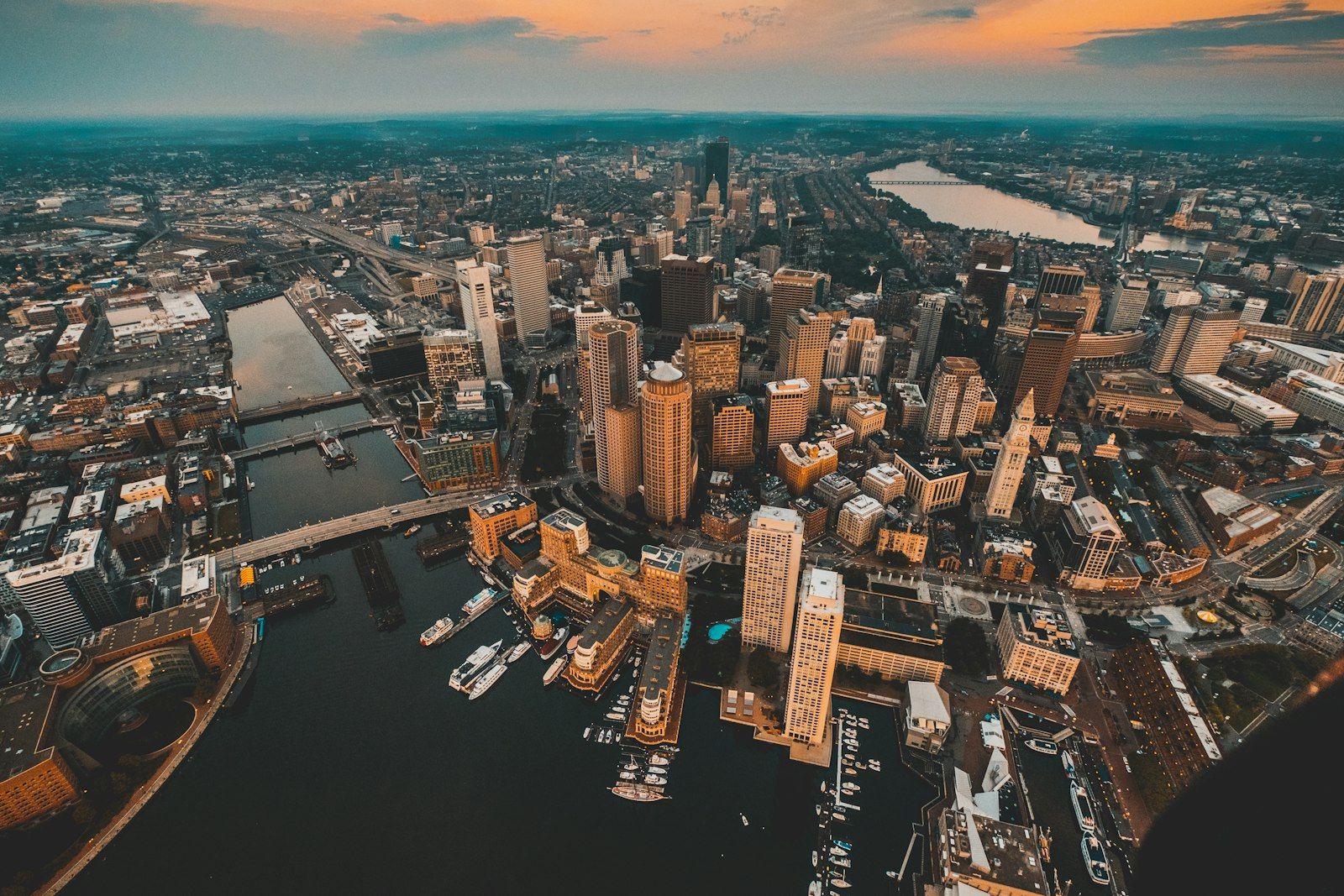 Dense metro skyline along the water at dusk