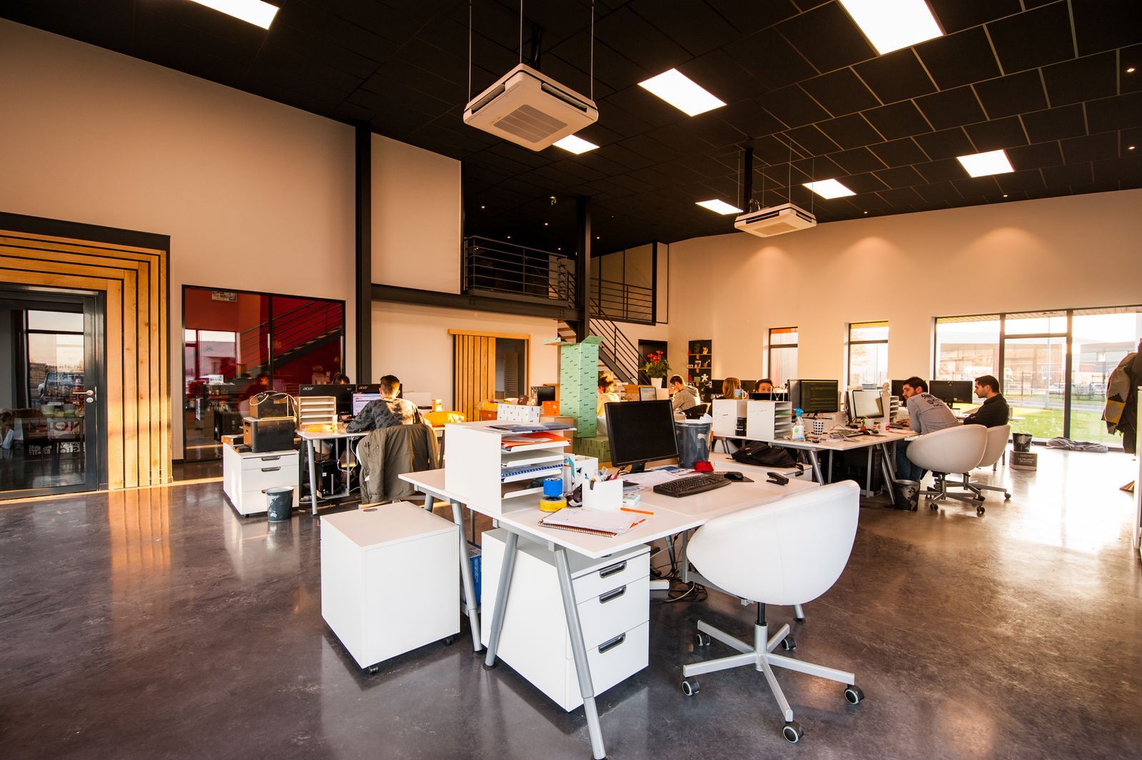 Open plan office with wood floors ready for the workday