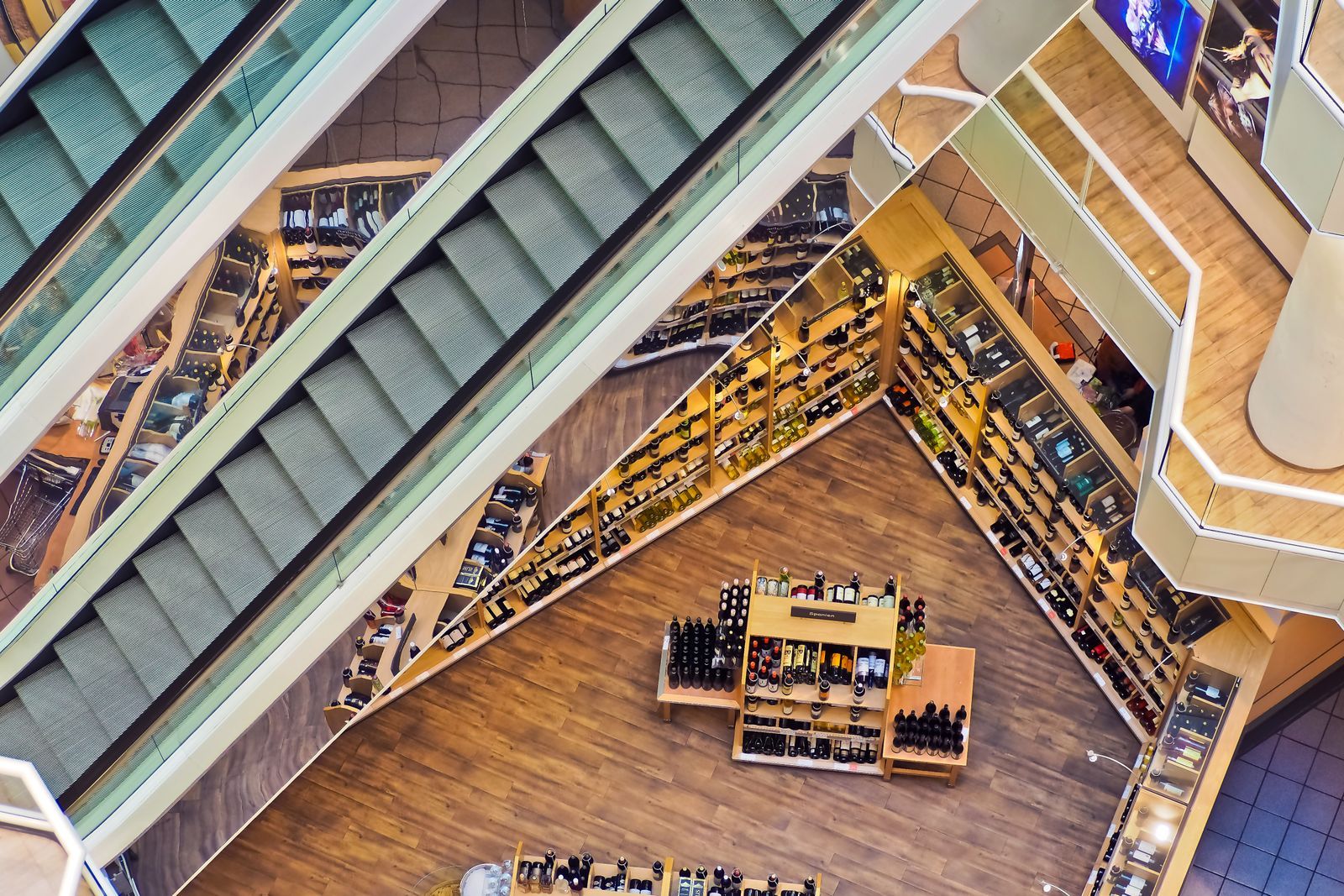 Multi-level retail store seen from above with escalators